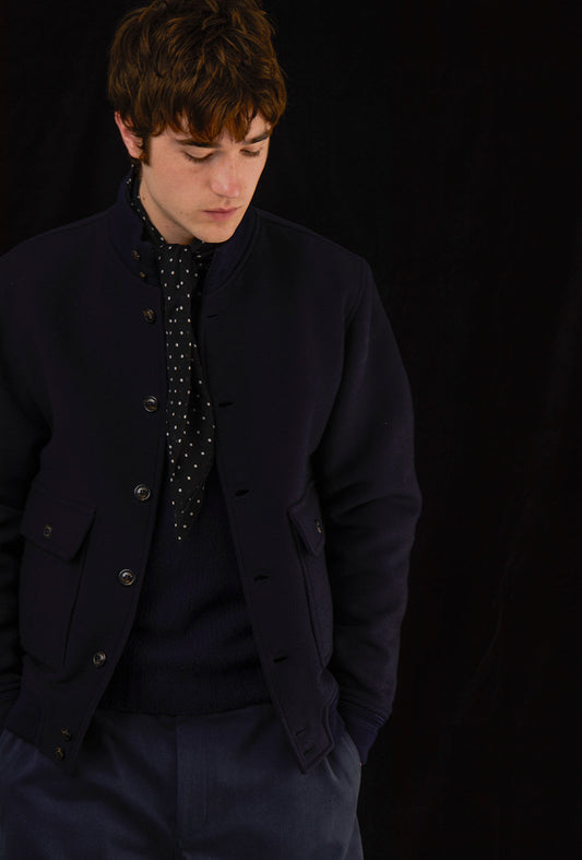 Man wearing a navy outfit.
