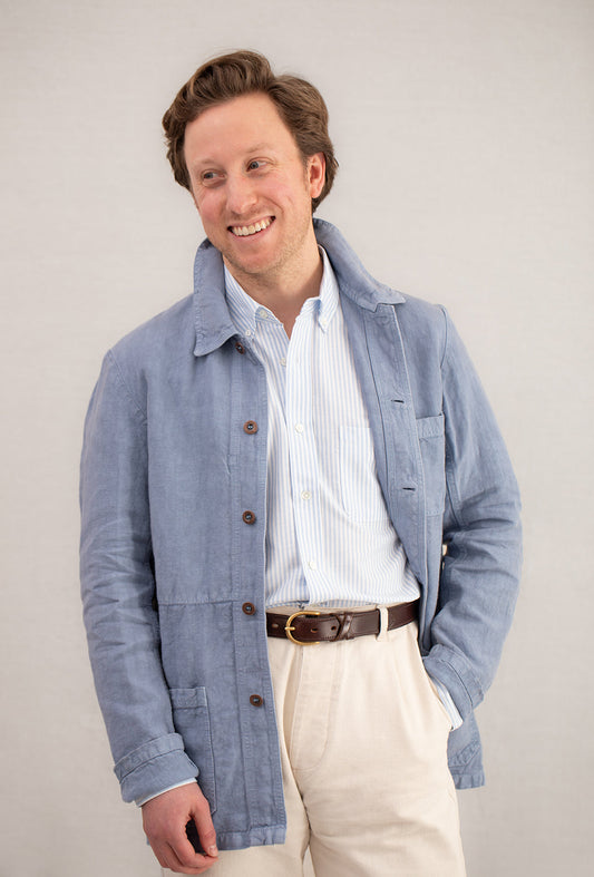 A Man Wearing an Oxford Shirt with Chore Coat