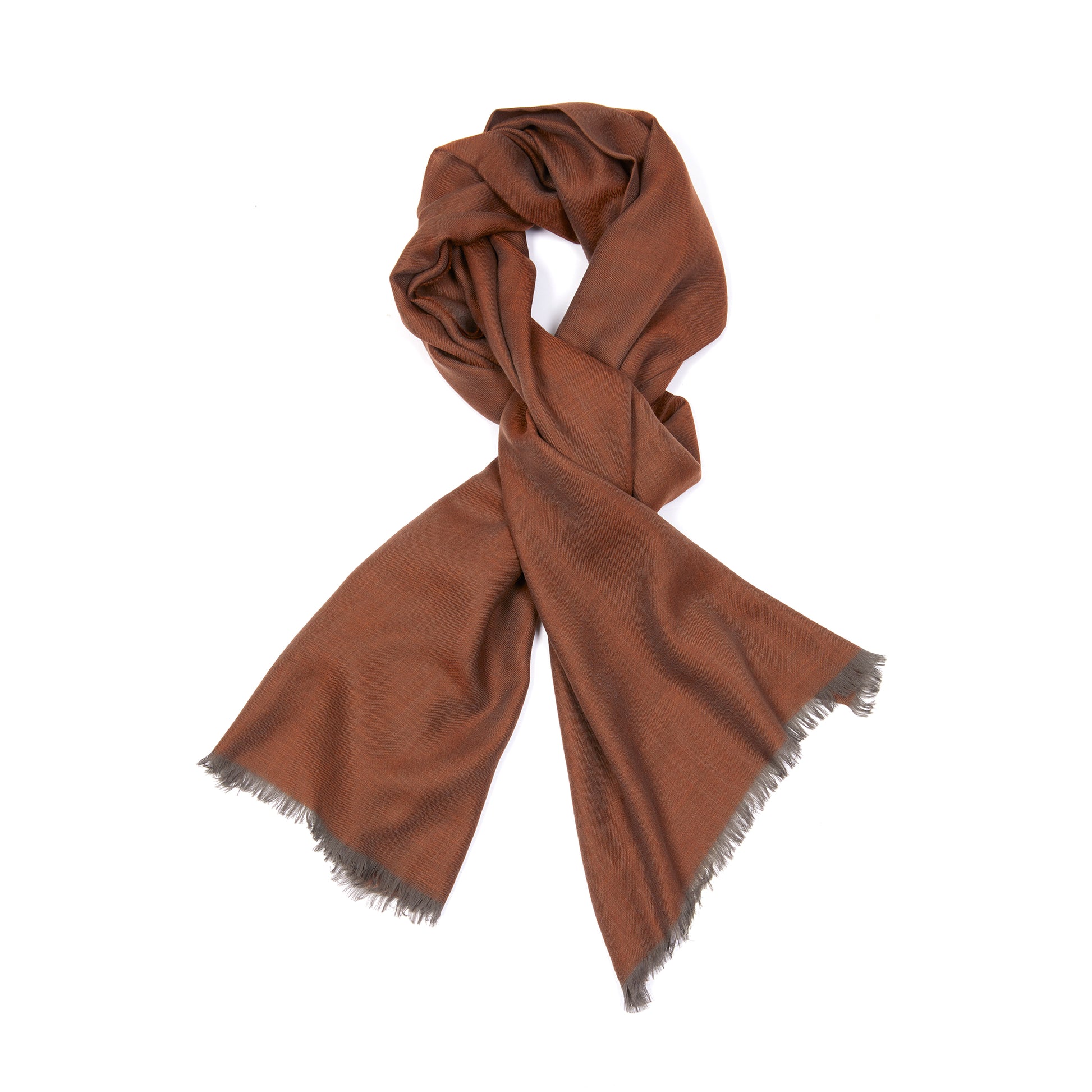 Wispy superlight cashmere scarf. Each Wispy scarf contains 8km of the finest gossamer yarn sourced from goats on Inner Mongolia’s Alashan Plateau. Framed with eyelash fringing.  70cm x 200cm.  100% Cashmere.
