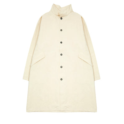 Oversized overcoat in a beautiful crisp cotton linen blend, off-white fabric. Generous stand collar, with volume through the body, front button closure, with two angled flap pockets.   72% Cotton, 28% Linen.