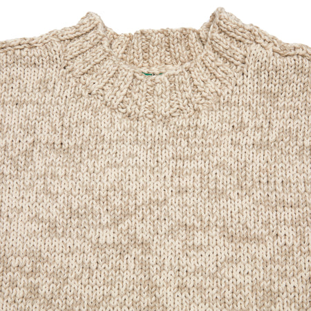 <p>Casey Casey Low Funnel Neck Sweater in Beige. Beautiful loosely hand knit sweater with drop sleeves in a cotton and virgin wool blend. The perfect relaxed summer layer.</p> <p>60% Cotton, 40% Virgin Wool.</p> <p>Made in Romania.</p>