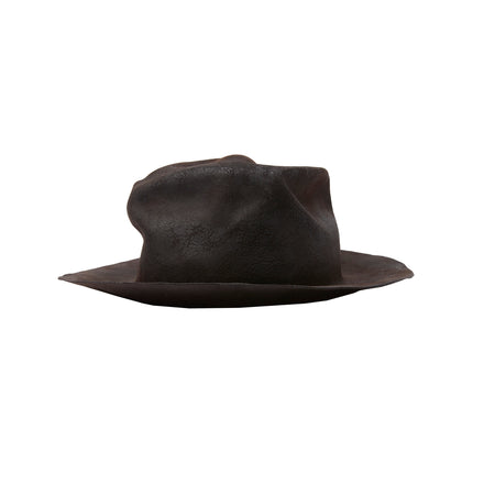 A beaver fur felt hat in a crushed style. Featuring a stretch lining, and is mouldable and foldable. With a hard burnt finish, this style will continue to develop a unique patina across time and use.  100% Beaver Fur Felt.  Made by hand in Sweden. 