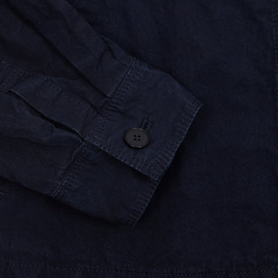 Drop shoulder coverall jacket in light cotton twill. This style features a stand collar, full button closure, and stepped hem.  100% Cotton.  Made in Japan.