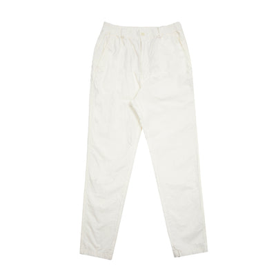 Sage De Cret Cotton/Hemp Tapered Pants in Off-White. Feature elasticated waist with self fabric belt loops, zip front with single button closure, two front angled hip pockets and two back welt pockets with tuckable pocket flaps. Comfortable fit with tapered leg in cotton and hemp blend weather cloth.  76% cotton / 24% hemp.  Made in Japan.