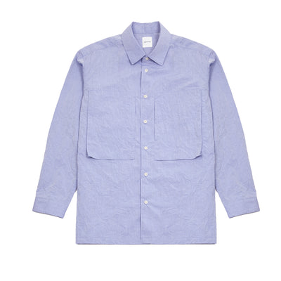 Sage De Cret Cotton Typewriter Shirt in Saxe is a classic long-sleeve shirt in organic cotton broadcloth. Relaxed cut with curved hem, two chest patch pockets, and finished with mother of pearl buttons. Garment washed to give intentional creases for that 'worn in' look.  100% cotton.  Made in Japan.