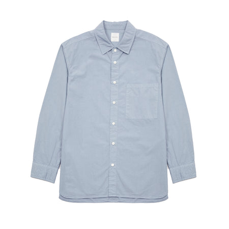 Sage de Cret Cotton Shirt in Saxe is a classic long-sleeve shirt in organic cotton broadcloth. Relaxed cut with curved hem, one chest patch pocket and finished with mother of pearl buttons. Garment washed to give intentional creases for that 'worn in' look.  100% cotton.  Made in Japan.