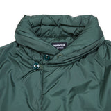 Close up: Loft Technical Nylon Vest in Emerald is a padded layering piece for extra warmth. Featuring off-centre button closure to keep the cold out, front slash pockets, and a miniature shawl neckline that can be turned up against the elements. The waist has an adjustable drawstring for fit and to keep cosy.  100% nylon. Filling: 100% Polyamide Primaloft insulation.