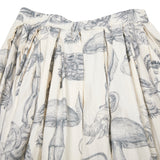 Double rideaux skirt in can can print, a beautiful, sophisticated, hand sketched printed fabric. Mid-length gathered skirt with an elasticated waist, herringbone tape drawstring inside the waistband, and hip pockets concealed in the side seams.  100% Cotton.  Made in France.
