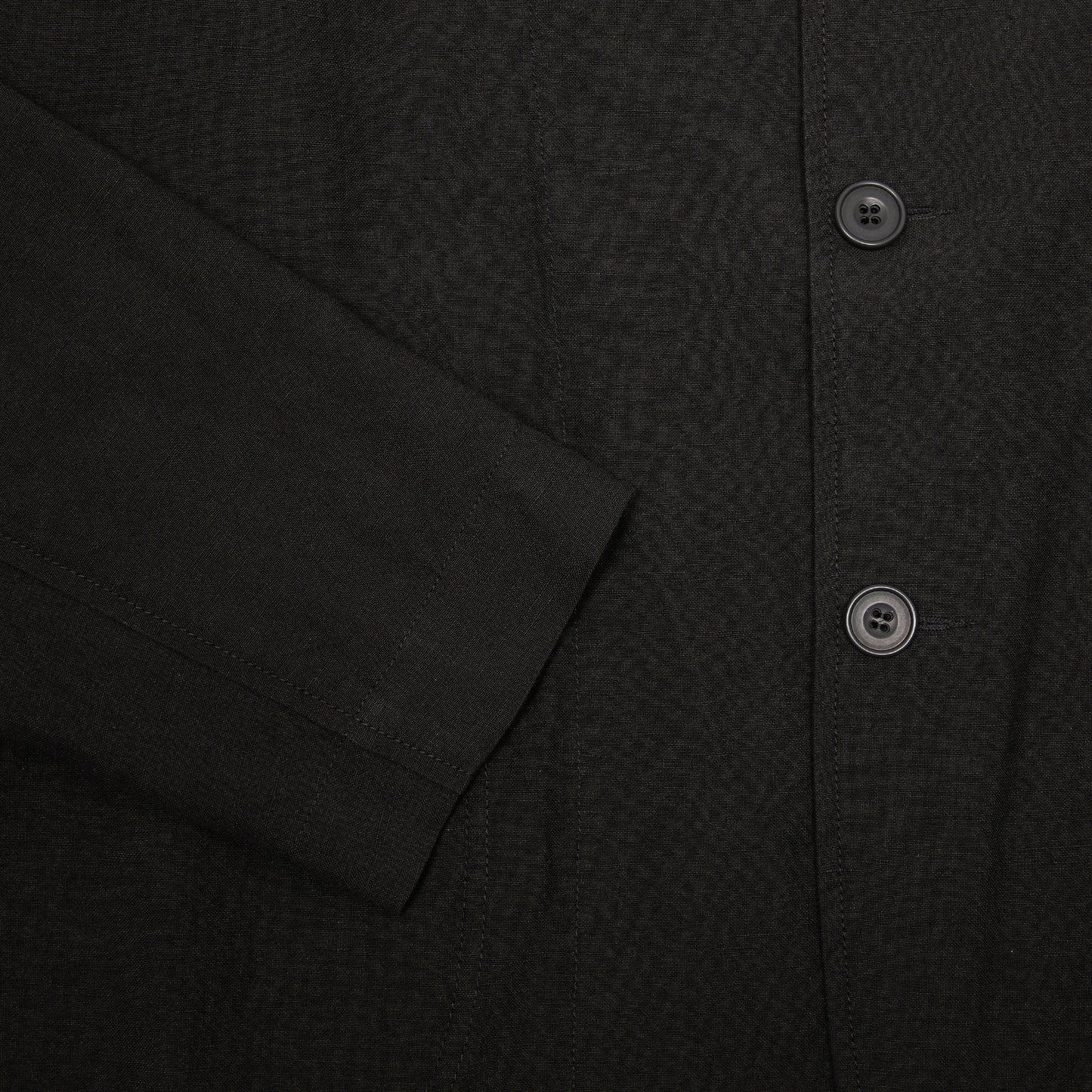 Casey Casey Jak Pat  Reversible Jacket in Black. A three-button jacket with button flap pockets and lapels.