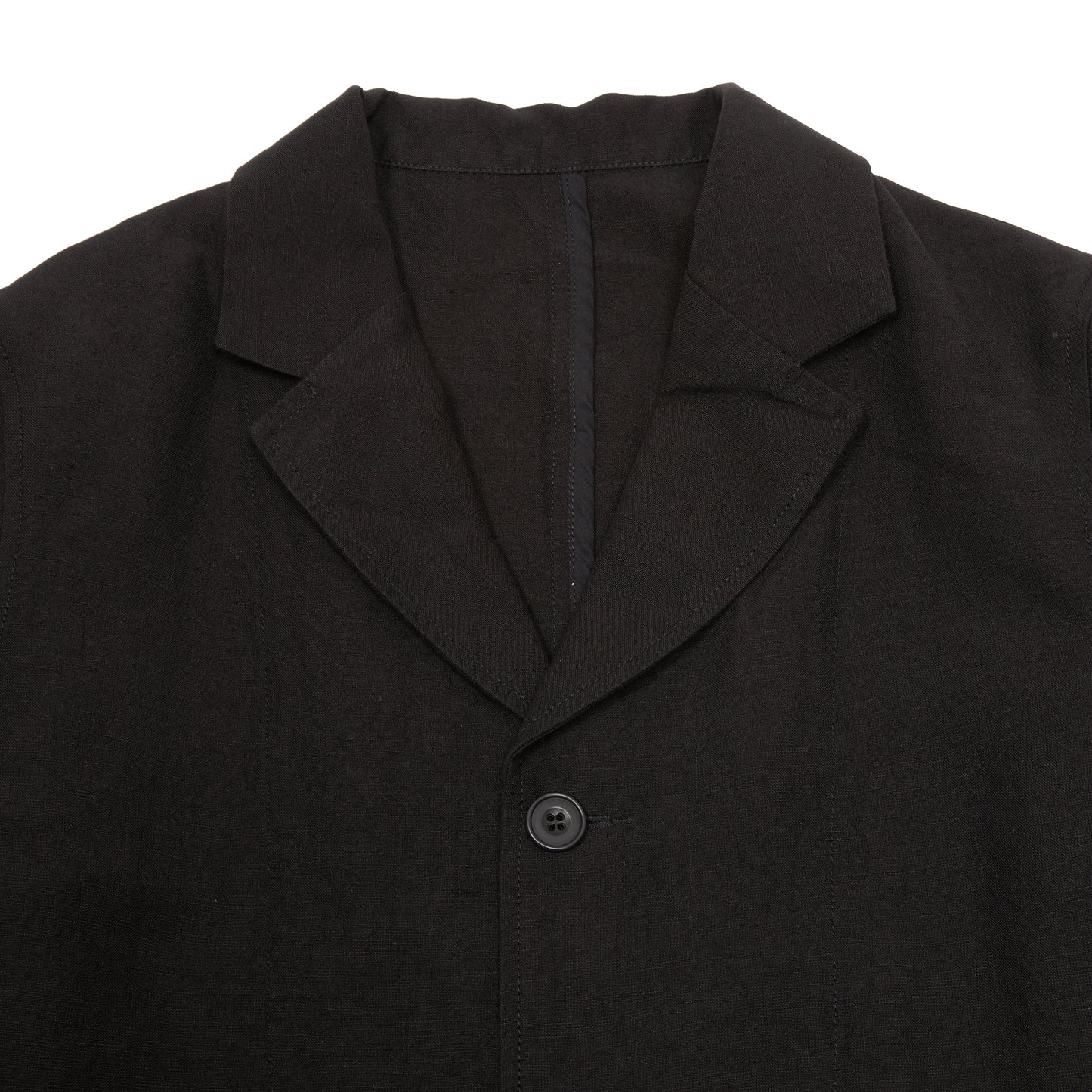 Casey Casey Jak Pat  Reversible Jacket in Black. A three-button jacket with button flap pockets and lapels.