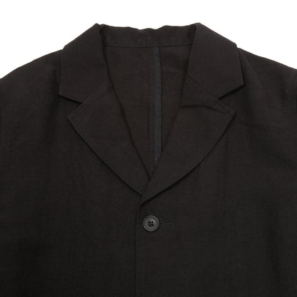 Casey Casey Jak Pat  Reversible Jacket in Black. A three-button jacket with button flap pockets and lapels.
