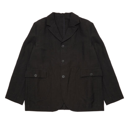 Casey Casey Jak Pat  Reversible Jacket in Black. A three-button jacket with button flap pockets and lapels.