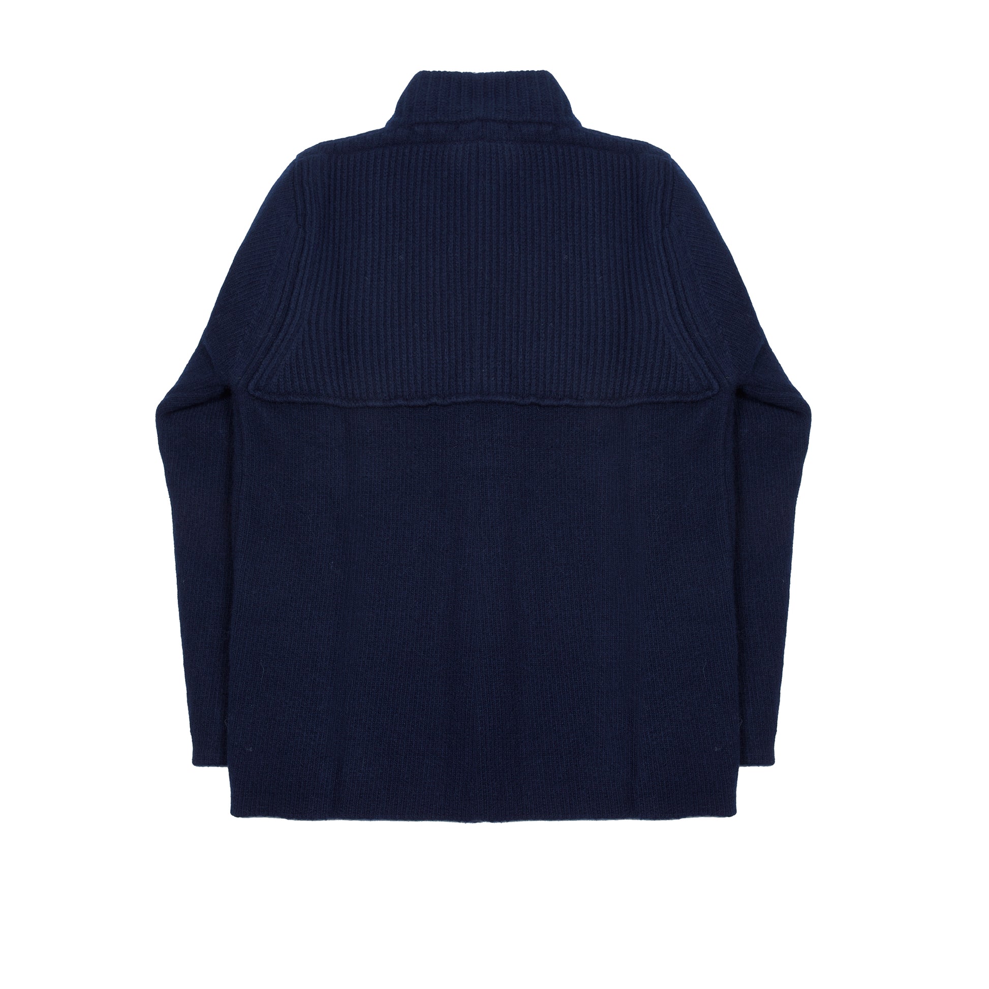 In solid navy, the Storm Jacket from Inis Meáin is inspired by island life and outdoor working in all weathers. Featuring knitted shoulder patches providing additional warmth and protection, patch pockets, a funnel collar, and finished with real horn buttons. The Storm Jacket is both functional and elegant.  70% Merino Wool, 30% Cashmere.   Made in Ireland.