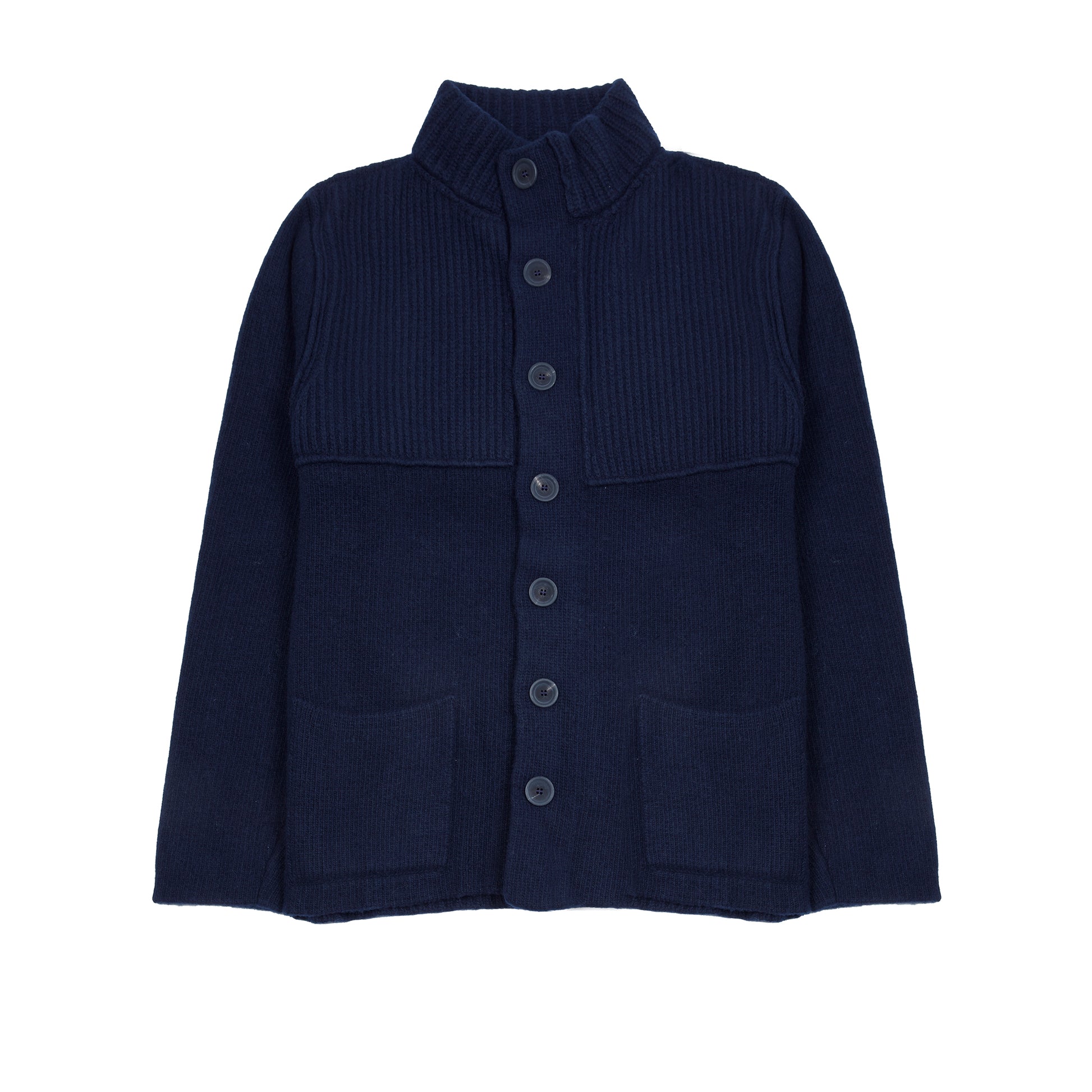 In solid navy, the Storm Jacket from Inis Meáin is inspired by island life and outdoor working in all weathers. Featuring knitted shoulder patches providing additional warmth and protection, patch pockets, a funnel collar, and finished with real horn buttons. The Storm Jacket is both functional and elegant.  70% Merino Wool, 30% Cashmere.   Made in Ireland.