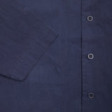 Ermou Kroynor Jacket with full button closure, shirt-style collar, two front patch pockets, and a raglan sleeve. This style has a wide, oversized cut for volume. The fabric has a crisp feel and will develop a unique patina over time through each wear. 79% Cotton, 21% Polyamide. Made in Italy.