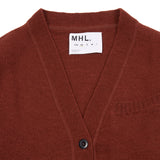 Welt Pocket Cardigan in Rust is a mid-weight knit in a relaxed cut. Featuring a contrast rib welt breast pocket, flatlock detailing on seams, and contrast rib on cuff and hem. The style is finished with a five corozo button closure.  100% Virgin Wool.  Made in U.K.