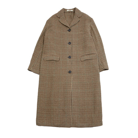 The Gwen Duster Coat in Pino is crafted from wool in a pied de poule pattern. Unlined and oversized for an effortless and comfortable look, this style has dropped shoulders and two welt pockets. Finished with horn buttons for the closure and on the cuffs.   100% Virgin Wool.  Made in Italy.