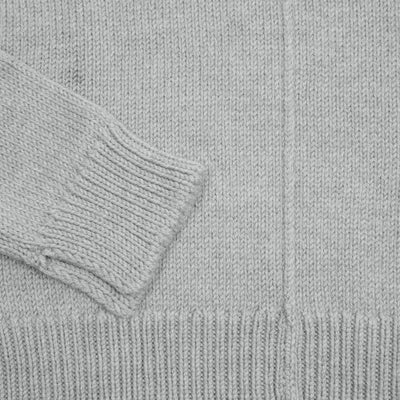 Rory Rollneck Sweater is an oversized cut with an asymmetric hem and exaggerated contrast rib detailing on hem and cuffs. This style features a drop shoulder, central seam detail on the front, and splits in the hem and cuffs for added comfort. A midweight knit with a soft hand.  100% Wool.  Made in Italy.