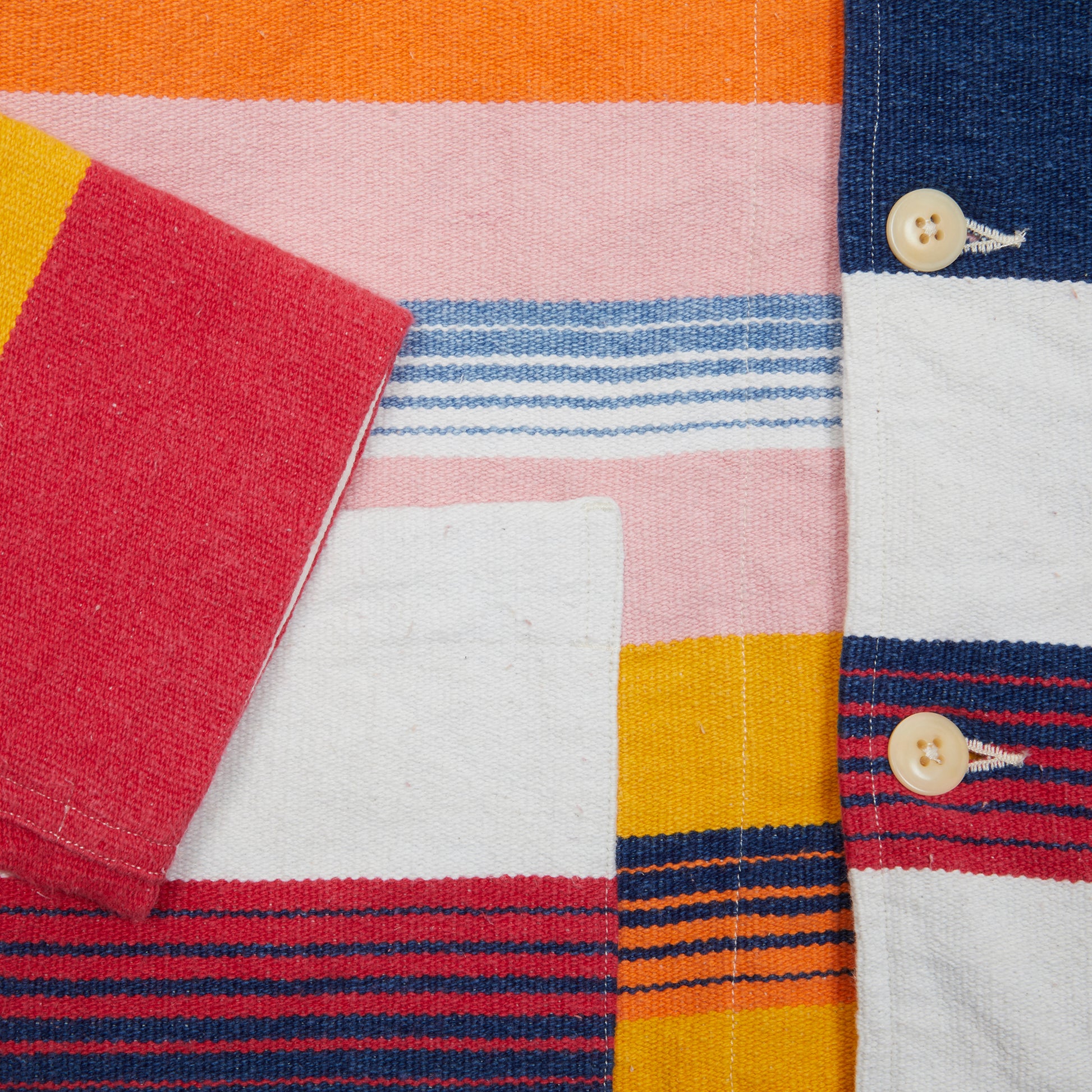 <p>Madras Stout Shirt Jacket in an incredible handwoven cotton, multicoloured stripe. Like the Original Madras beach mats, each over shirt is unique in fabrication. Jacket features three patch pockets, square hem, and natural Corozo buttons.&nbsp;<br></p> <p>100% Cotton.</p> <p>Made in Madras.</p>