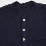 Natural cacao dyed blouse in navy light-weight cotton, a relaxed fit pop-over shirt with tunic collar, chest pocket, and curved hem.  Naturally dyed using cacao an artisanal dyeing technique.  100% Cotton.  Made in Japan. 