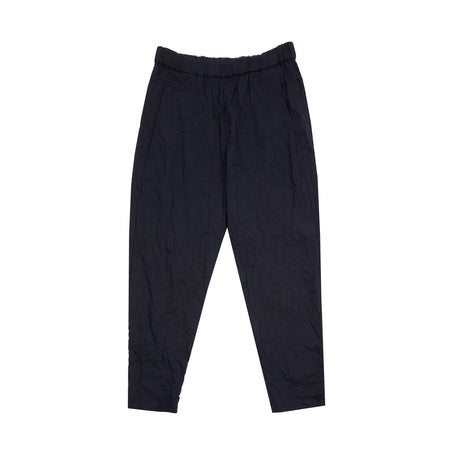 Linen blend trousers in a light-weight crinkled dark navy pinstripe. Relaxed fit, with tapered leg and elastic waistband. Hip pockets concealed in the side seams, and two back patch pockets. Easy, everyday trousers.  55% Linen, 28% Polyester, 15% Rayon, 2% Polyurethane.  Made in Japan.