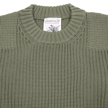The Rank-II Sweater references knitwear made by SNS Herning for the Danish Civil Defence in the 1970s. Featuring a round neck and knitted shoulder and elbow patches; made of a heavy weight merino wool.  100% virgin merino wool.  Knitted in Italy.