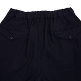 Cotton/Linen Tumbler Pleated Pants in Navy have an elasticated waist and a relaxed fit. This style features front side slant pockets and back buttoned flap pockets.  80% Linen, 20% Cotton.  Made in Japan.