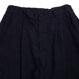 Cotton/Linen Tumbler Pleated Pants in Navy have an elasticated waist and a relaxed fit. This style features front side slant pockets and back buttoned flap pockets.  80% Linen, 20% Cotton.  Made in Japan.