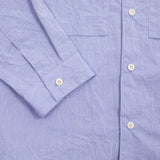 Sage De Cret Cotton Typewriter Shirt in Saxe is a classic long-sleeve shirt in organic cotton broadcloth. Relaxed cut with curved hem, two chest patch pockets, and finished with mother of pearl buttons. Garment washed to give intentional creases for that 'worn in' look.  100% cotton.  Made in Japan.