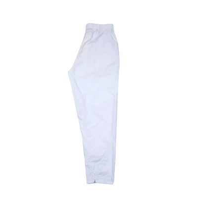 The Acrobat Trouser is a loose fitting trouser crafted from a crisp cotton with a soft laundered finish. This style features a tapered leg with a contoured seam and notch ankle detail, two hip pockets, and an elasticated waist with an inner drawstring.  100% Cotton.