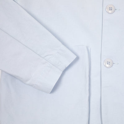 The Bookbinder Jacket in cotton is a key piece for any modern minimalist wardrobe. The oversized front pockets are perfectly balanced by the neat collar and tonal buttons.  100% Cotton.  Made in Portugal.