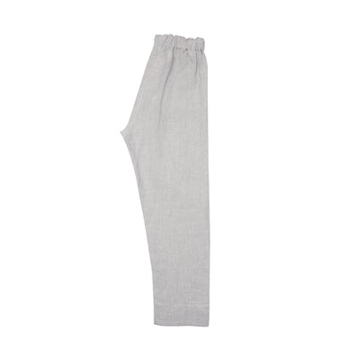 The Perfumer Trouser is a relaxed loose tapered fit with a drop crotch, two angled front patch pockets, and an elasticated waist with inner drawstring closure.  100% Linen.  Made in Poland.