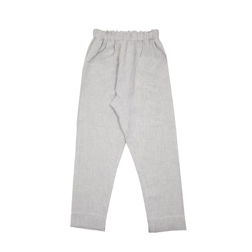 The Perfumer Trouser is a relaxed loose tapered fit with a drop crotch, two angled front patch pockets, and an elasticated waist with inner drawstring closure.  100% Linen.  Made in Poland.