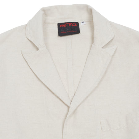 Peaked blazer in linen and cotton hopsack. Three button jacket; unstructured and unlined. 56% Cotton / 44% Linen. Made in France.