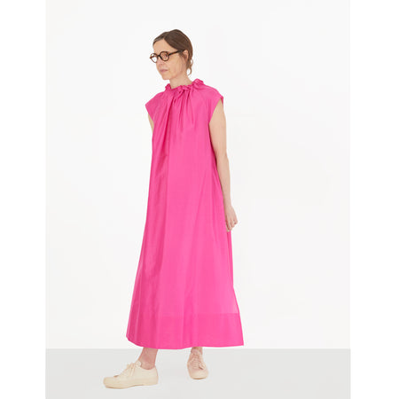The Magician Dress is full-length with high ruffled neckline and cap-sleeves. This style features invisible in-seam pockets, side vents, and keyhole button closure at the back. Crafted from a lightweight cotton/silk blend.   78% Cotton, 22% Silk.  Made in Portugal.