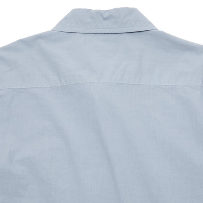 Sage de Cret Cotton Shirt in Saxe is a classic long-sleeve shirt in organic cotton broadcloth. Relaxed cut with curved hem, one chest patch pocket and finished with mother of pearl buttons. Garment washed to give intentional creases for that 'worn in' look.  100% cotton.  Made in Japan.