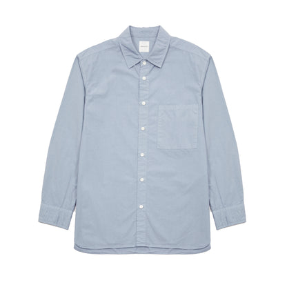 Sage de Cret Cotton Shirt in Saxe is a classic long-sleeve shirt in organic cotton broadcloth. Relaxed cut with curved hem, one chest patch pocket and finished with mother of pearl buttons. Garment washed to give intentional creases for that 'worn in' look.  100% cotton.  Made in Japan.